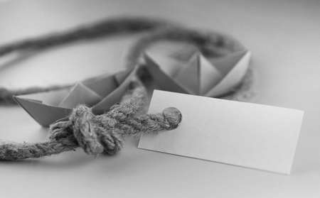 white sticker with thick braided rope and ship paper origamiの写真素材
