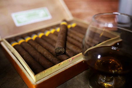 Large box of Cuban cigars on a wooden table in a presentable packageの写真素材