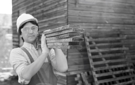 man in workers clothes black and white