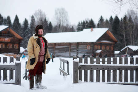 Traditional winter costume of peasant medieval age in russiaの写真素材