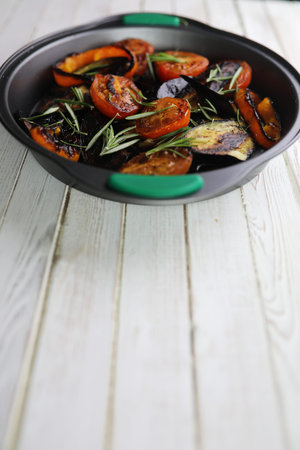 Summer vegetables grilled pan fried eggplant and tomatoesの写真素材