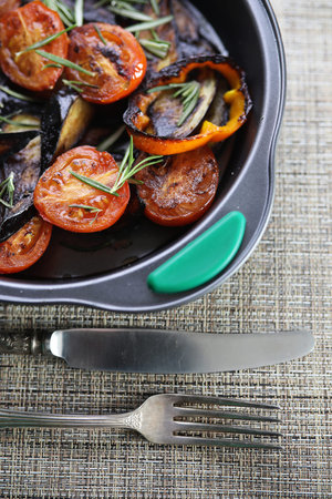 Summer vegetables grilled pan fried eggplant and tomatoesの写真素材