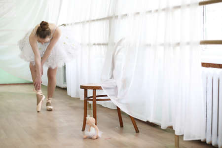 Pretty girl ballet dancer practicingの写真素材