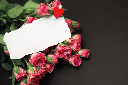 Bouquet of red roses on black matte backgroundの写真素材
