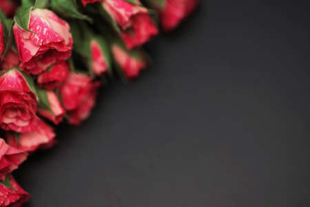 Bouquet of red roses on black matte backgroundの写真素材