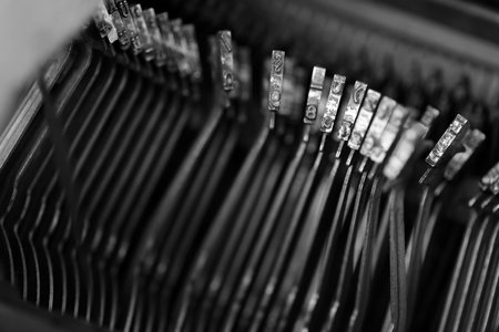 Different small metal elements of an old typewriter macro