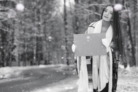 A girl in a winter cloudy day