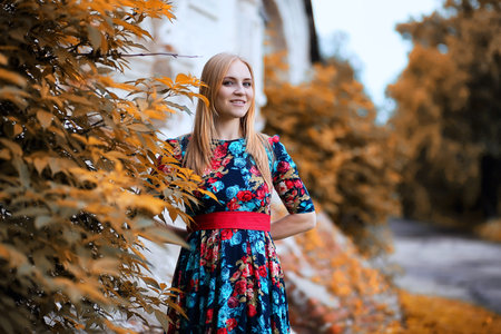 Girl in the street with an umbrellaの写真素材