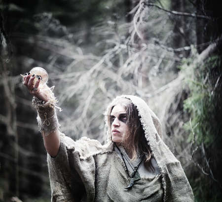 Fairy magician. A sorcerer with a glass sphere, a magical spellの写真素材