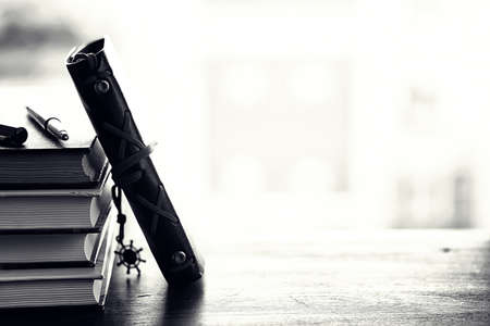 A stack of textbooks on a tableの写真素材