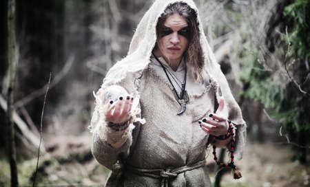 Fairy magician. A sorcerer with a glass sphere, a magical spellの写真素材