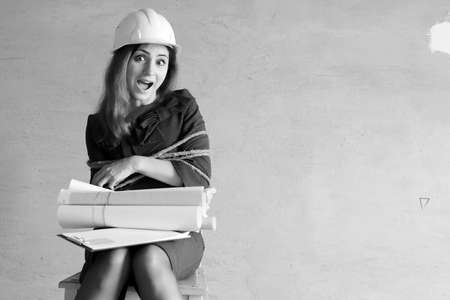 monochrome photo of a business woman sitting on chair associatedの写真素材