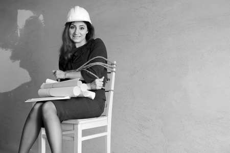 monochrome photo of a business woman sitting on chair associatedの写真素材