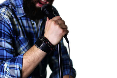 handsome and attractive man with a beard, posing at camera on an isolated white backgroundの写真素材