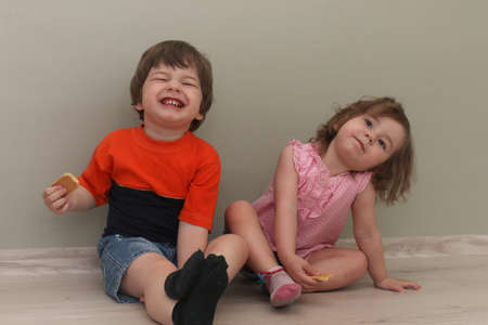 Young kid playing on a floor in a roomの写真素材