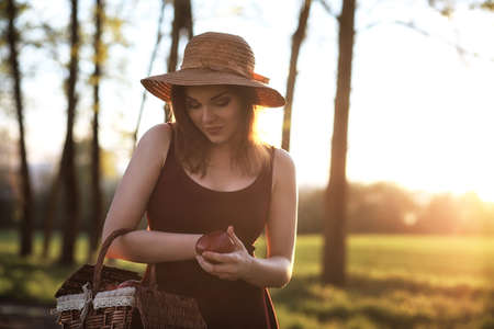 A girl at the countryside in the eveningの写真素材