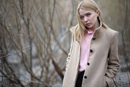 Cute blonde in a city parkの写真素材