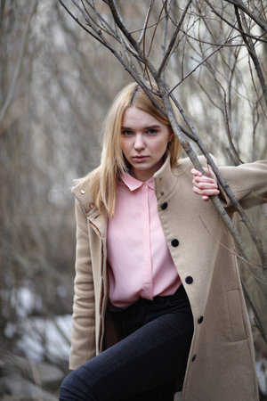 Cute blonde in a city park