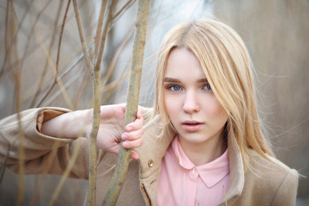Cute blonde in a city parkの写真素材