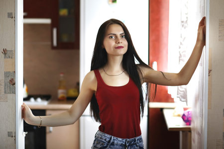 A pretty girl posing for the camera in an apartmentの写真素材