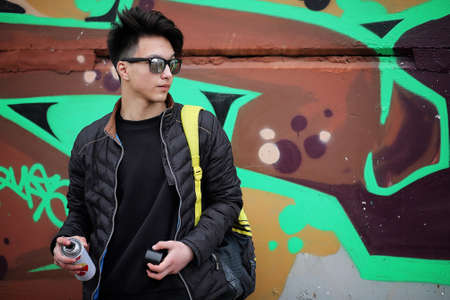 Asian young adult man on street posing at the cameraの写真素材