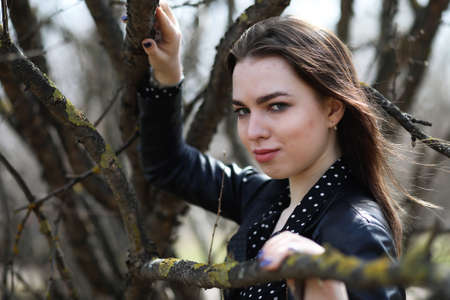 A girl going for a walk in the park in springの写真素材