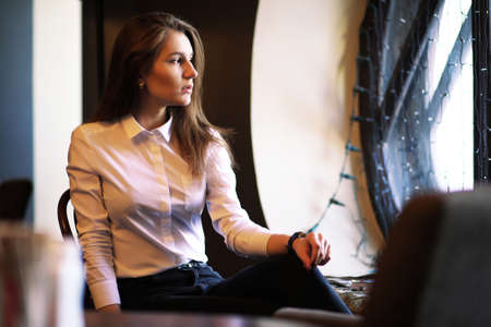 A girl in a vintage cafeの写真素材