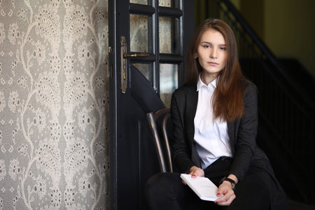 A girl sitting in a cafeの写真素材