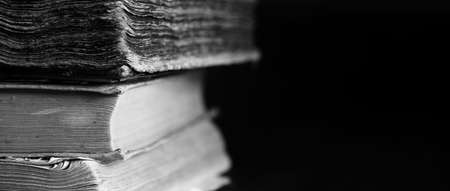 Background of old shabby books. Long background of vintage educational books and encyclopedias. The background of studying books old.の写真素材