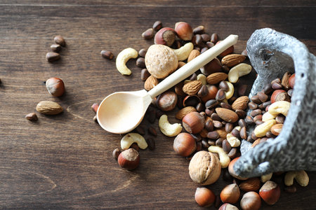 Tasty nuts on a wooden tableの写真素材