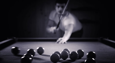A man with beard playing a big billiard in a 12-foot pool party