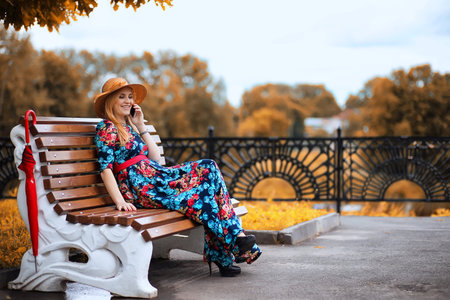 Girl in the street with an umbrellaの写真素材