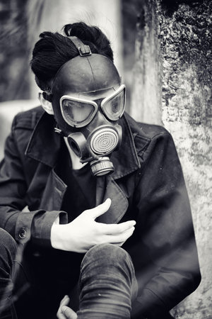 The guy in the coat and gas mask. Post-apocalyptic portrait of Aの写真素材
