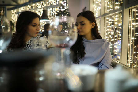 The girls in the evening rest in a cafeの写真素材