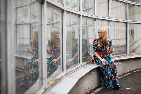 Girl in the street with an umbrellaの写真素材