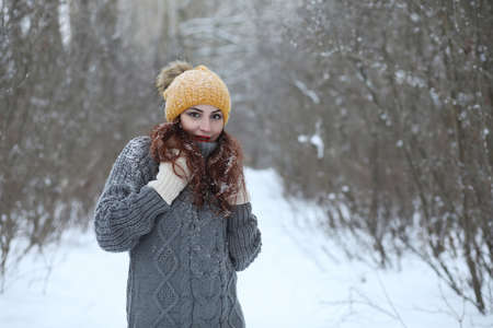 Beautiful girl in a beautiful winter parkの写真素材