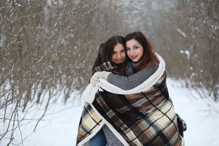 Beautiful girl in a beautiful winter parkの写真素材