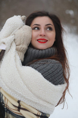 Beautiful girl in a beautiful winter parkの写真素材