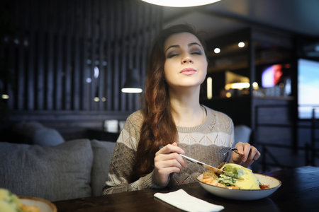 Beautiful girl in a cafeの写真素材