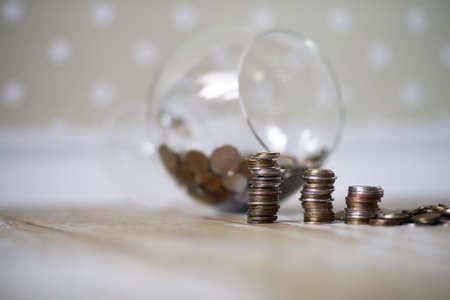 coins stacked in piles on the floorの写真素材