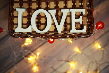 word Love from wooden letters on background