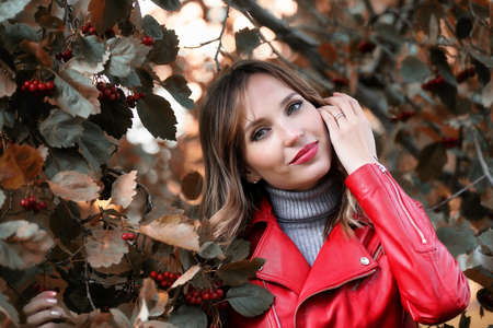 Beautiful girl in the park autumnの写真素材