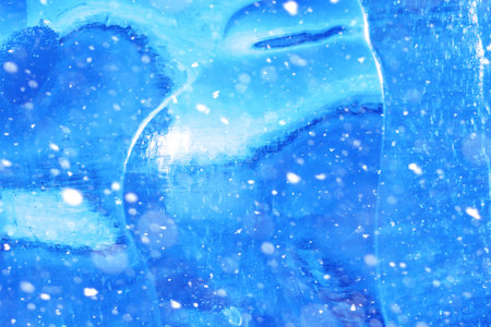 Texture of ice in winter. Pieces of frozen water on a street in the winter. The texture and texture of the frozen water in winter and outdoor.の写真素材