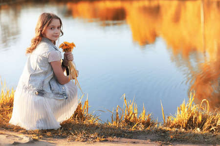 Girl walking in the autumn park. Autumn in the city, girl with dの写真素材
