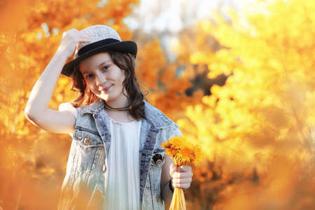 Girl walking in the autumn park. Autumn in the city, girl with dの写真素材