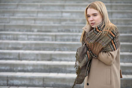 Cute blonde in the city drinking coffeeの写真素材
