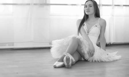 Young ballet dancer on a warm-up. The ballerina is preparing toの写真素材