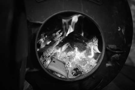 Wood burning stove. Firewood for furnace heating. Warehouse forの写真素材