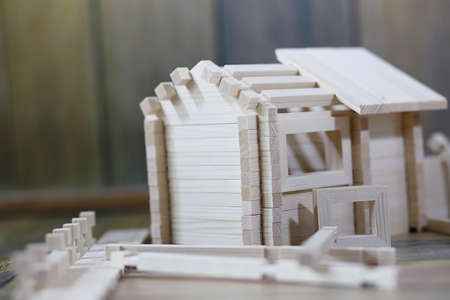 Toy wooden house. The constructor is made of natural wood for chの写真素材