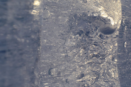 Texture of ice in winter. Pieces of frozen water on a street inの写真素材